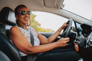 Portrait of a woman driving a car